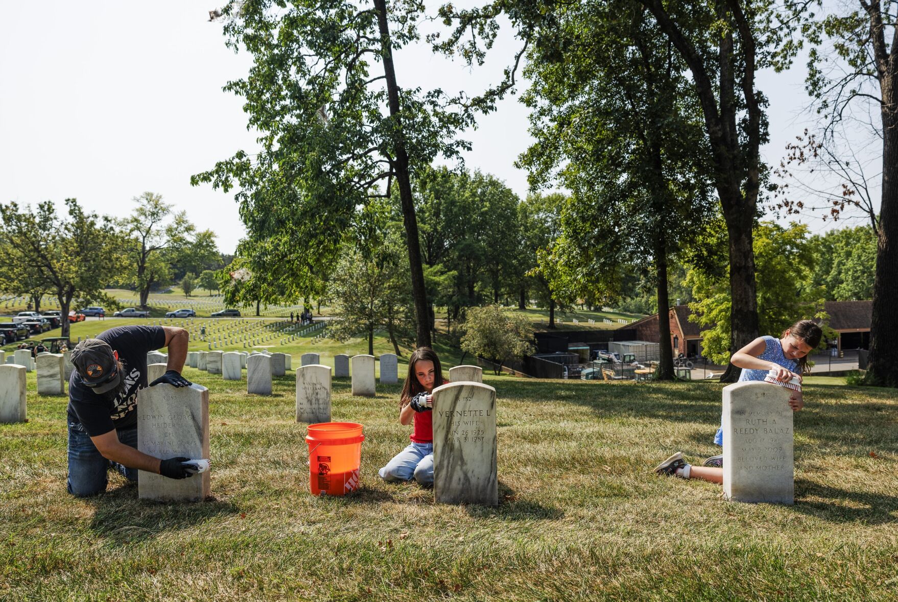 Volunteers beautify veterans' headstones in remembrance of 9/11